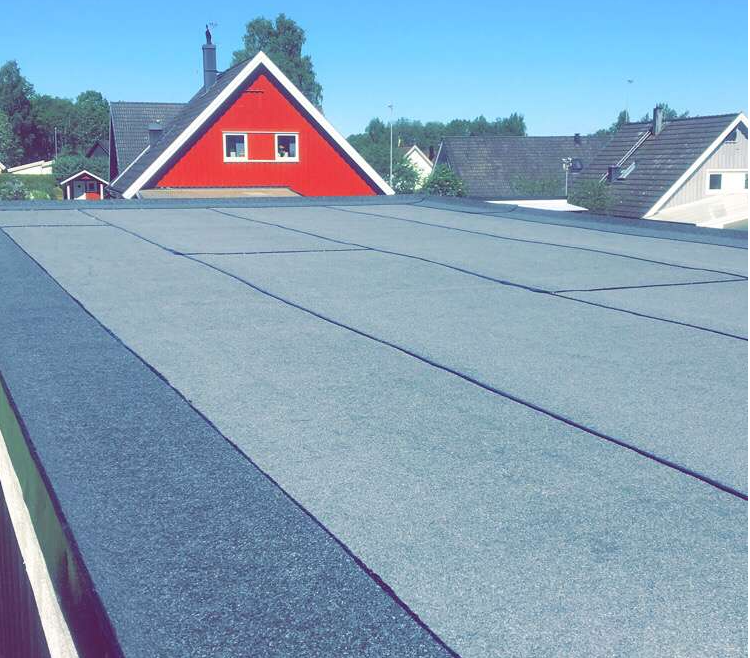 Bild 1 av referensprojekt Renovering av garagetak, Vadstena.