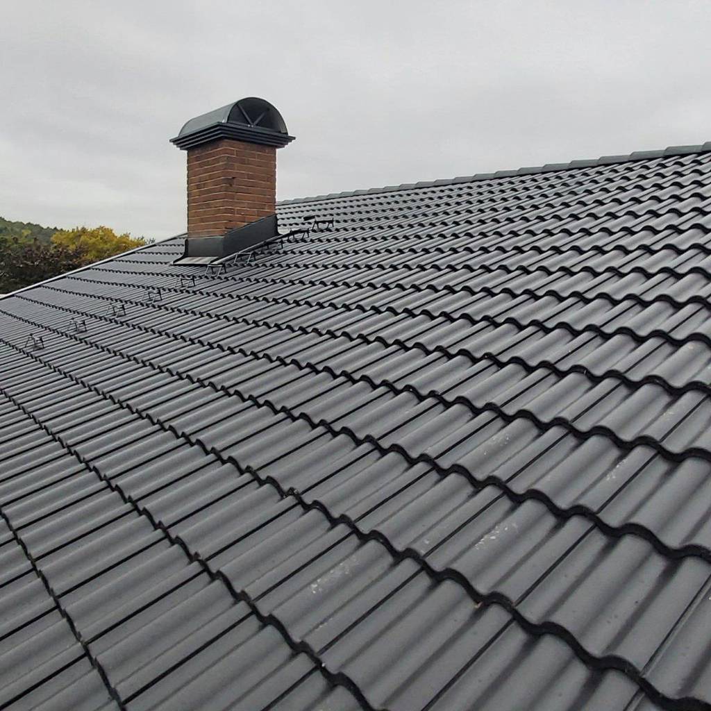 Bild 2 av referensprojekt Takomläggning på villa i Floda